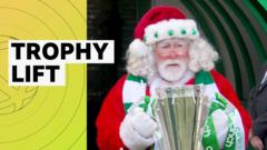 santa-claus-presents-celtic-with-scottish-premiership-trophy